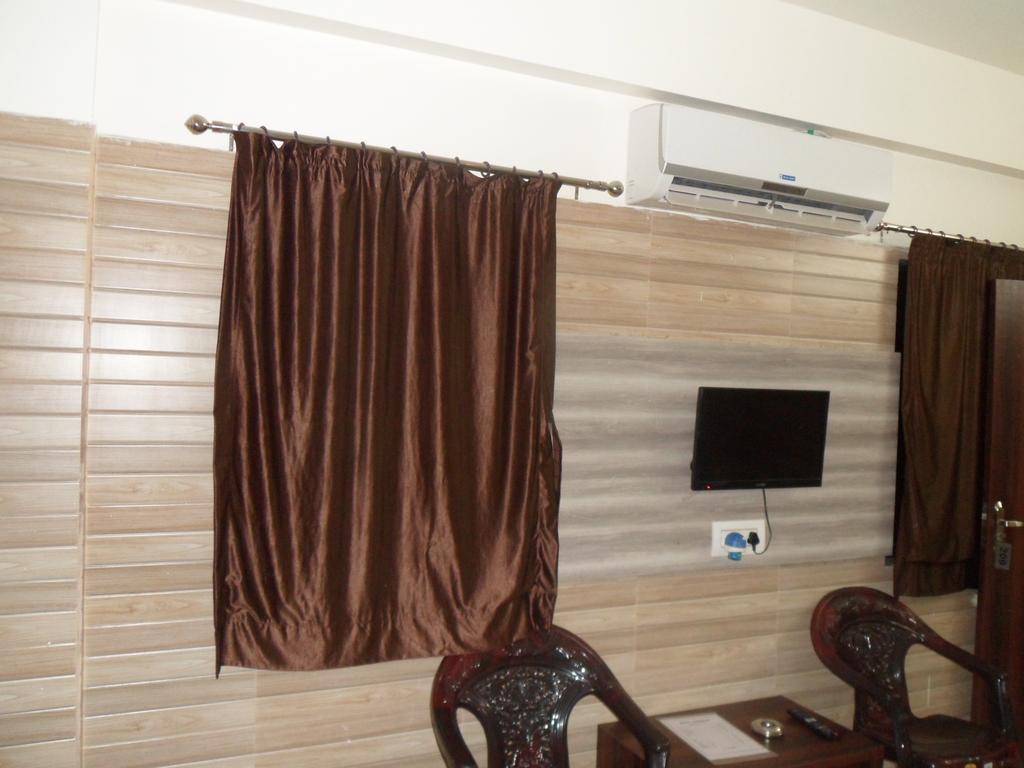 Hotel Madhusudan Dwārka Pokoj fotografie