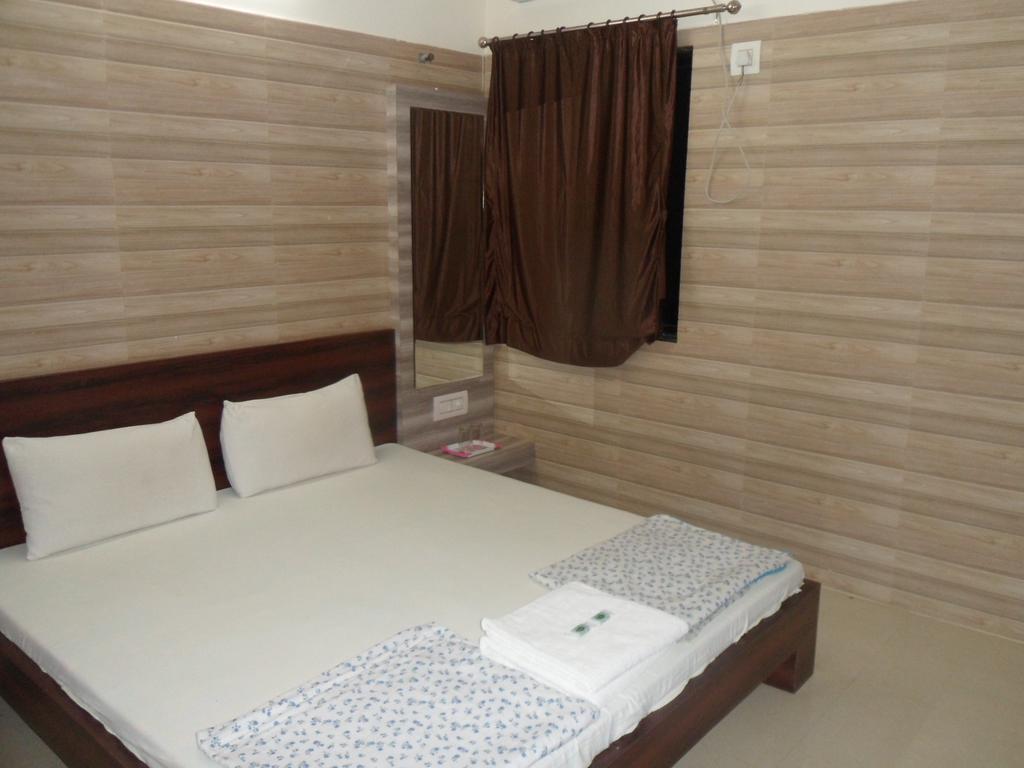Hotel Madhusudan Dwārka Pokoj fotografie